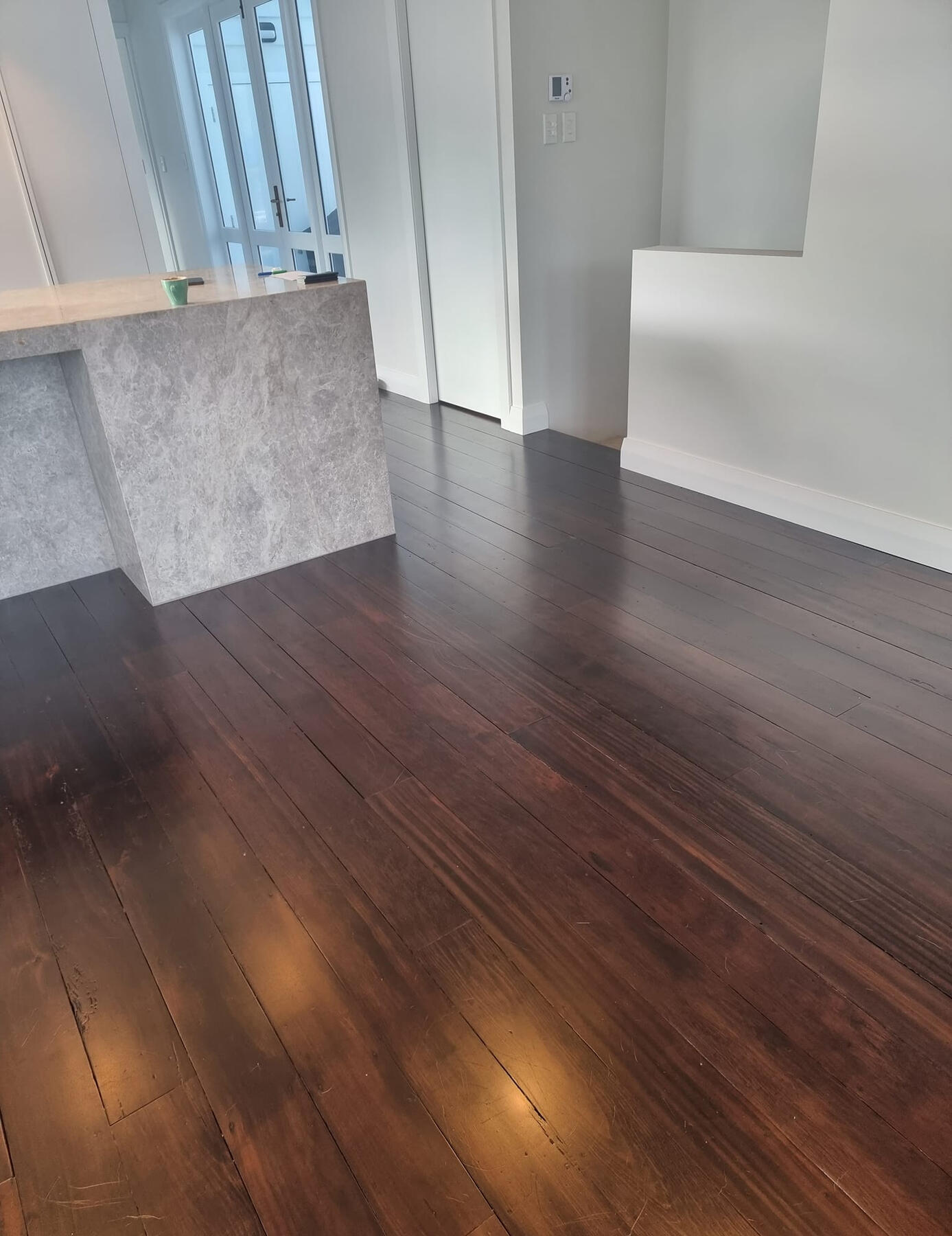 Stained walnut matai floor in Wellington